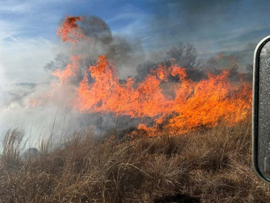 PHOTOS: Multiple departments battle grass fire in Kansas