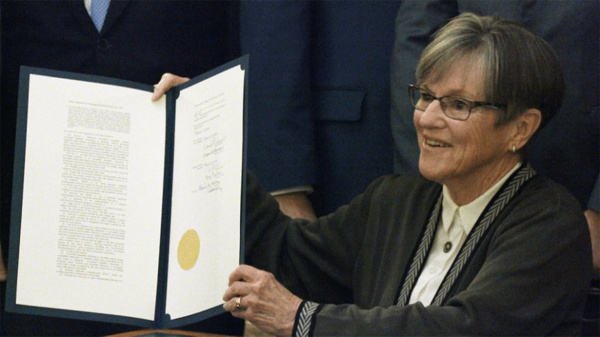 Kansas gov. gives green light to school cell phone ban