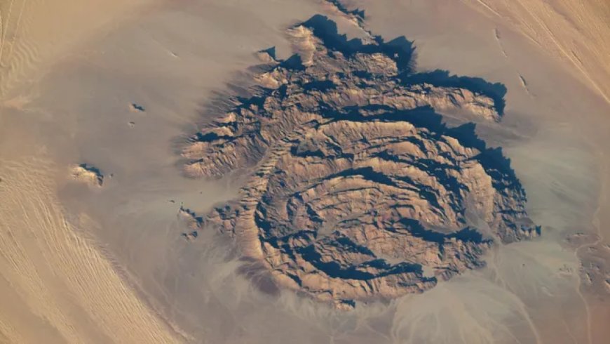 Concentric rocky rings in the Sahara look like an impact crater — but astronaut photos reveal a far stranger origin
