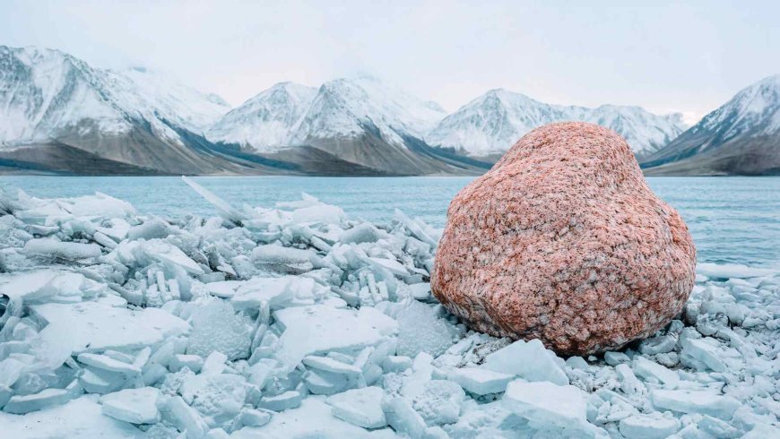 Rare pink rocks are emerging from the ground in Antarctica, and researchers believe a hidden island may lie beneath the ice