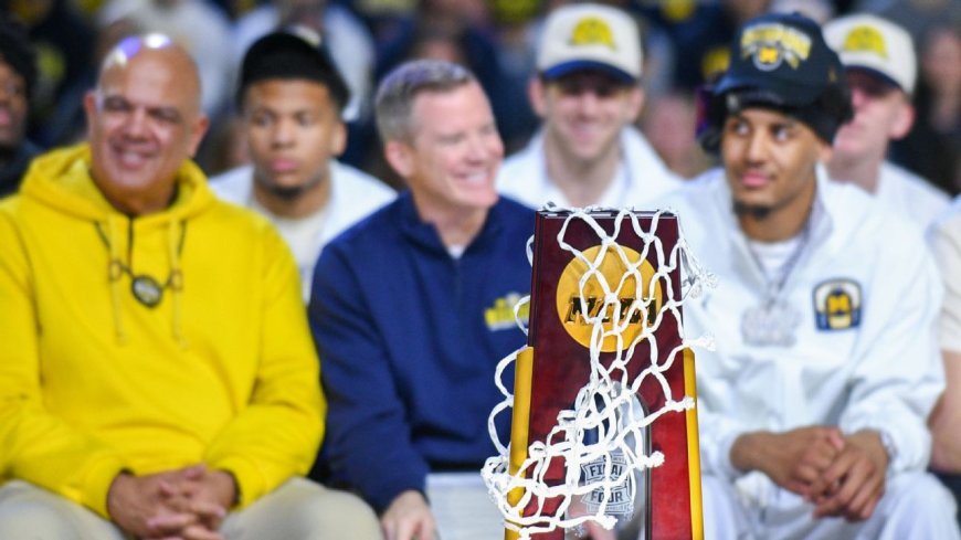 May agrees to new deal, Michigan AD Manuel says