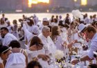 Dinner party has guests bringing tables, dressing in white and learning location at last minute