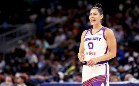 Social media explodes as WNBA star Kelsey Plum leaps into the arms of opposing coach during play