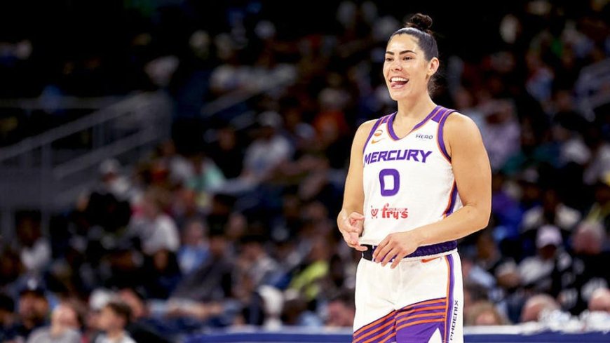 Social media explodes as WNBA star Kelsey Plum leaps into the arms of opposing coach during play