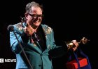 Alan Carr holds back tears on special night at National Television Awards