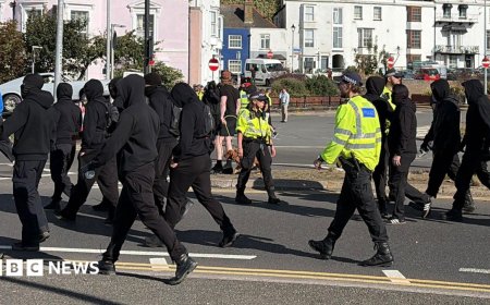 Use all powers necessary on anti-migrant protests, home secretary tells police